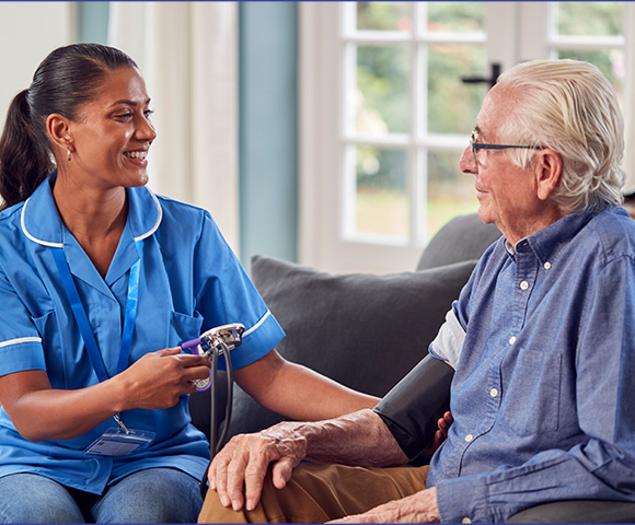female nurse measuring blood pressure of elderly man in comfortable setting with caring interaction three health care insights