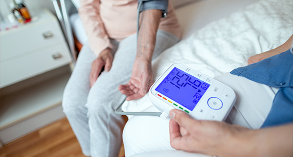 elderly woman receiving respiratory treatment wearing mask while caregiver administers medication in healthcare setting 3 important factors for health