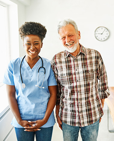 smiling healthcare professional with patient in medical office joyful interaction 2 people two smiling