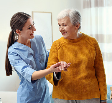 healthcare worker assisting elderly woman with support and comfort in a home setting 2 elderly care solutions