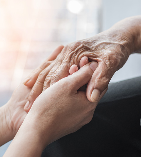 two hands holding each other symbolizing care and connection showcasing love and support for five generations